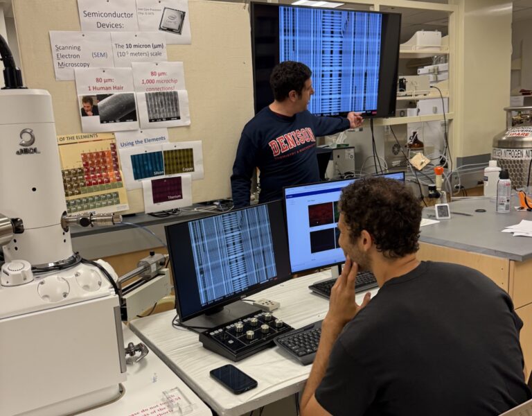 Denison Professor, Joe Reczek, works with a student in a semiconductor lab